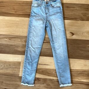 Cute girls skinny jeans with frayed bottom. Size 10